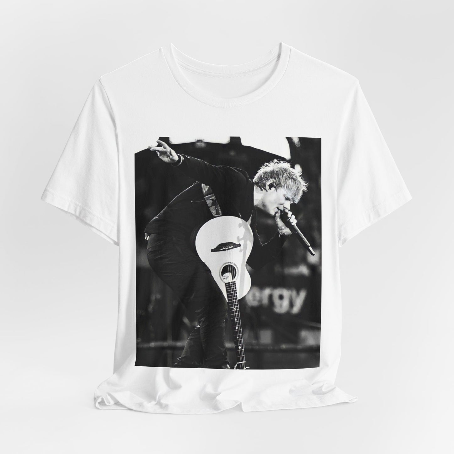 A black graphic t-shirt featuring a vintage graphic of Ed Sheeran performing live.