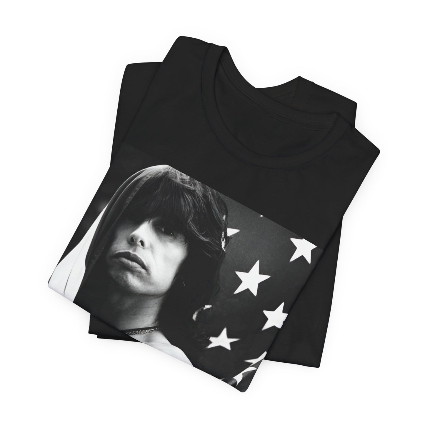 A black graphic t-shirt featuring a retro 70s-style illustration or photo of Aerosmith, integrated with elements of the American flag.