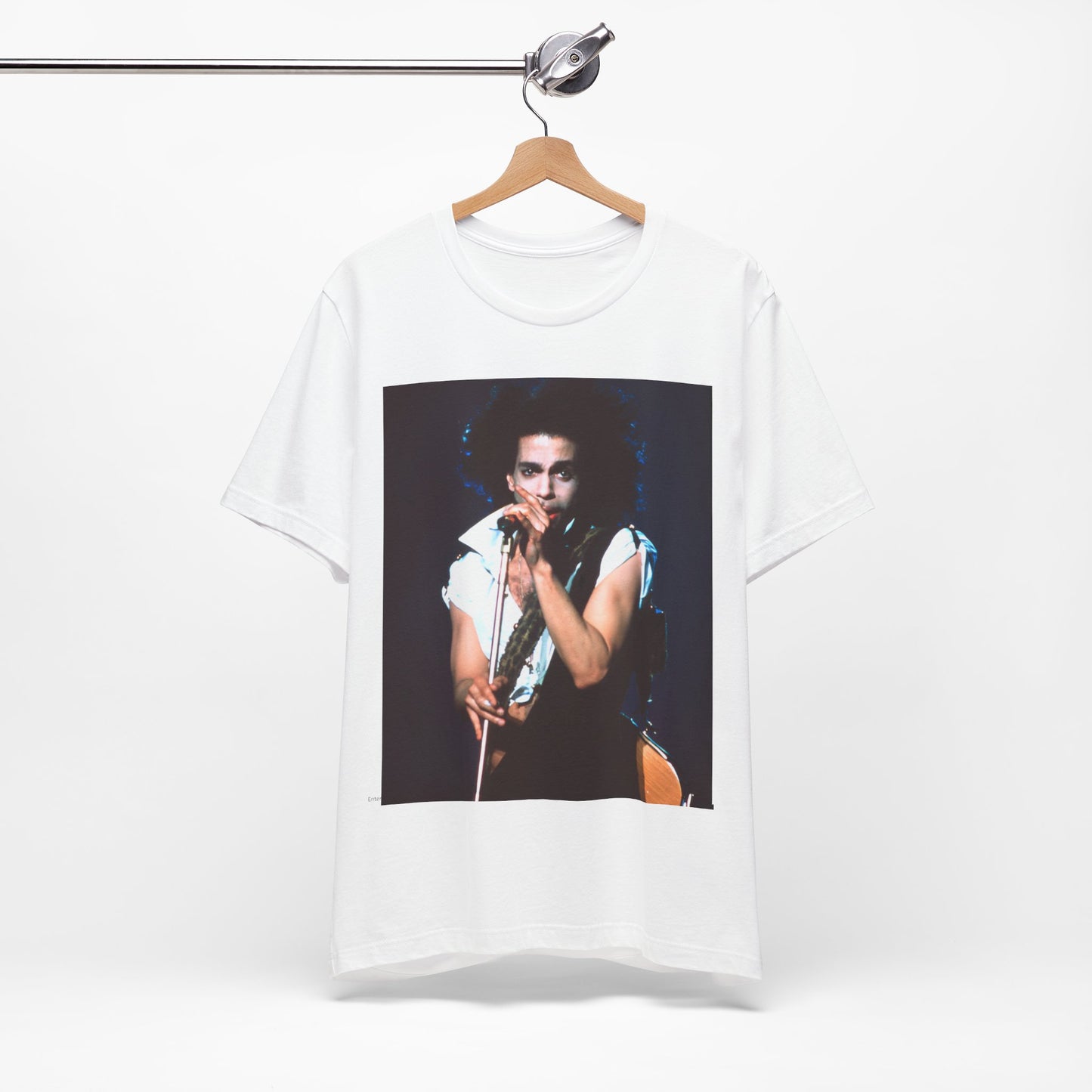 A black graphic t-shirt featuring a 90s live performance graphic of Prince.