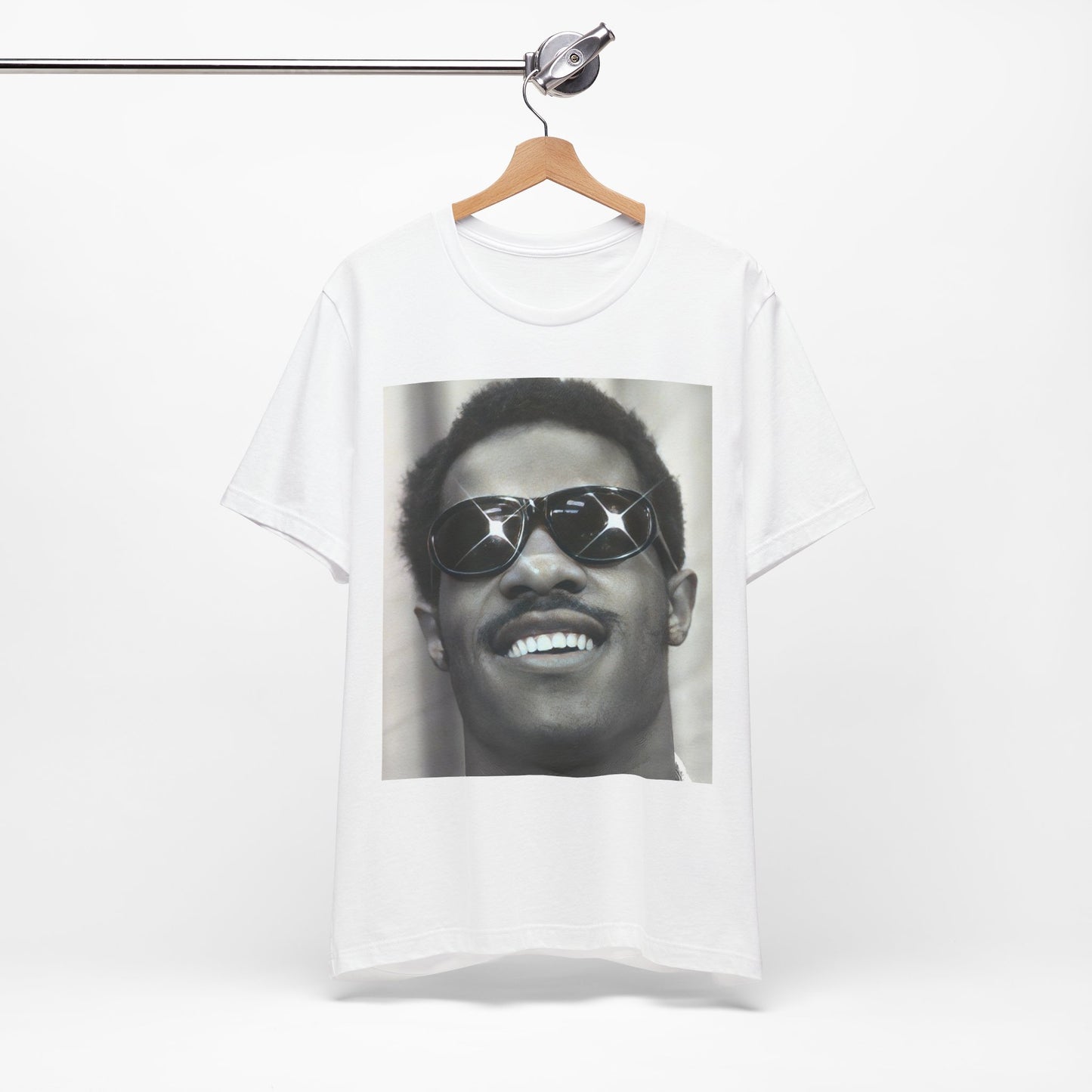 A black graphic t-shirt featuring a 70s funk aesthetic black and white graphic or photo of Stevie Wonder.