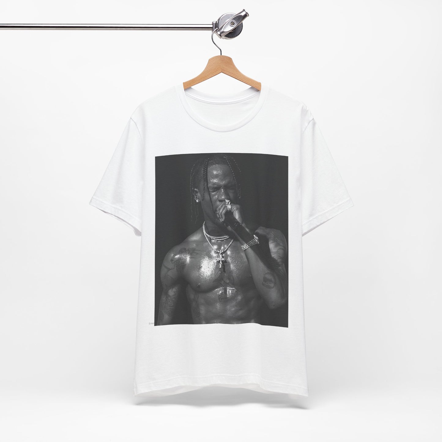 A black graphic t-shirt featuring an underground hip hop graphic of Travis Scott.