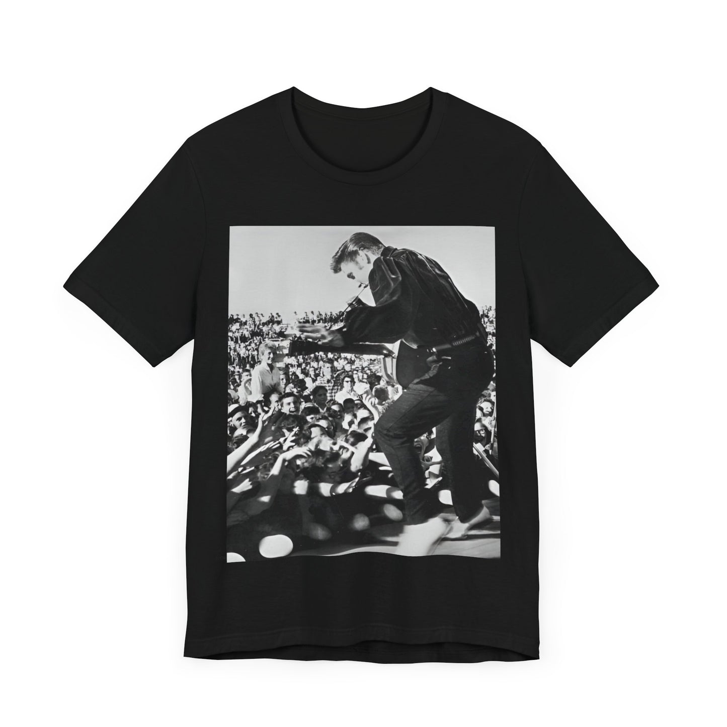 A black graphic t-shirt featuring a retro photo of Elvis Presley performing live in concert in the 1950s.