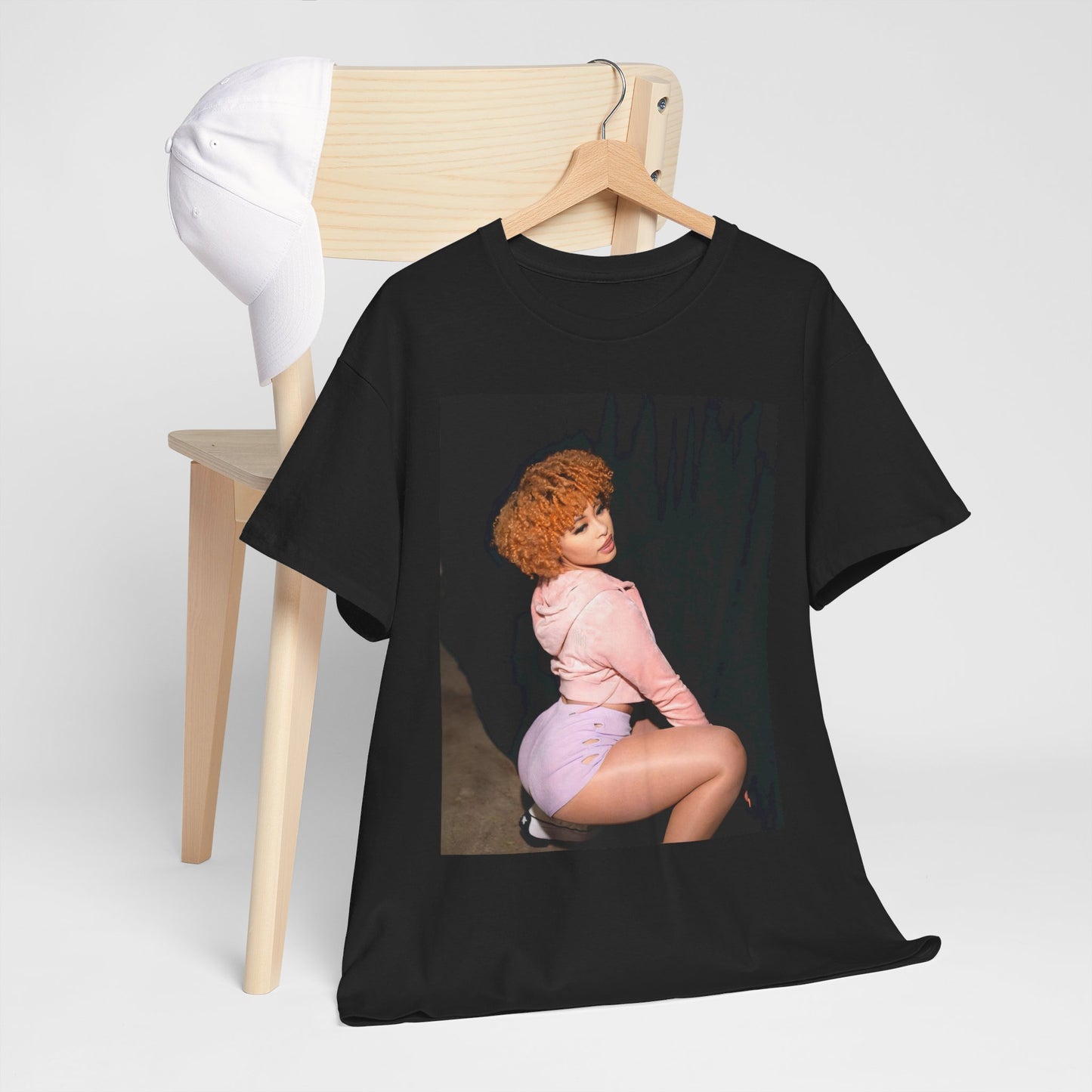 A black graphic t-shirt featuring a graphic of Ice Spice as a rap iconic viral sensation.