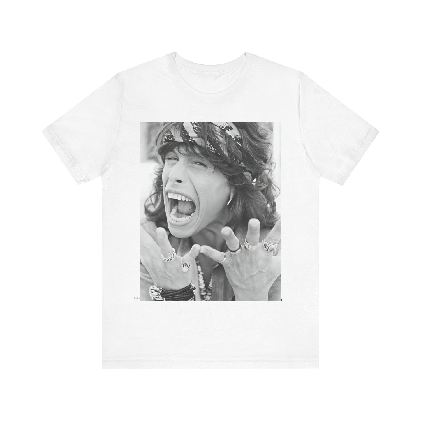 A black graphic t-shirt featuring a candid, dynamic photo of Aerosmith band members on tour in the 1970s, possibly showing action or interaction on stage or backstage.