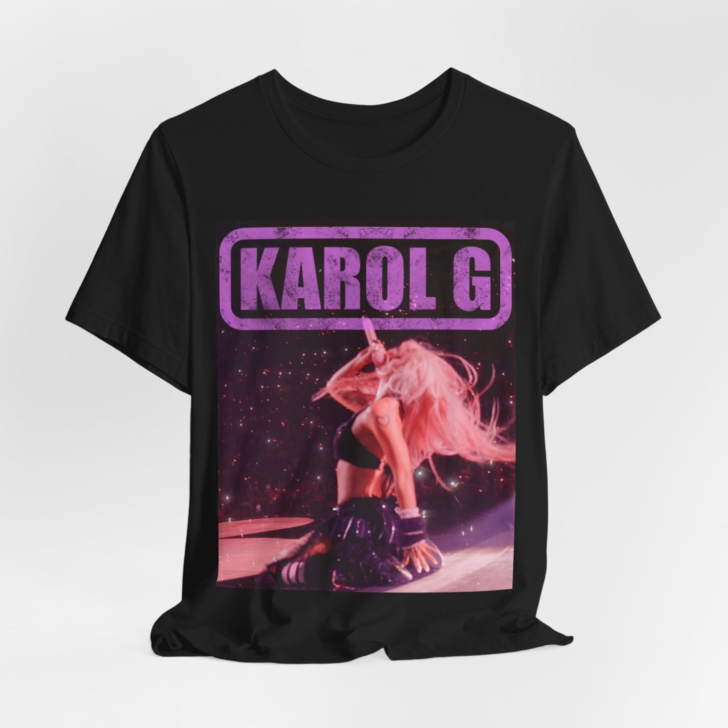 A black graphic t-shirt featuring a glamorous graphic or photo of Karol G performing live.