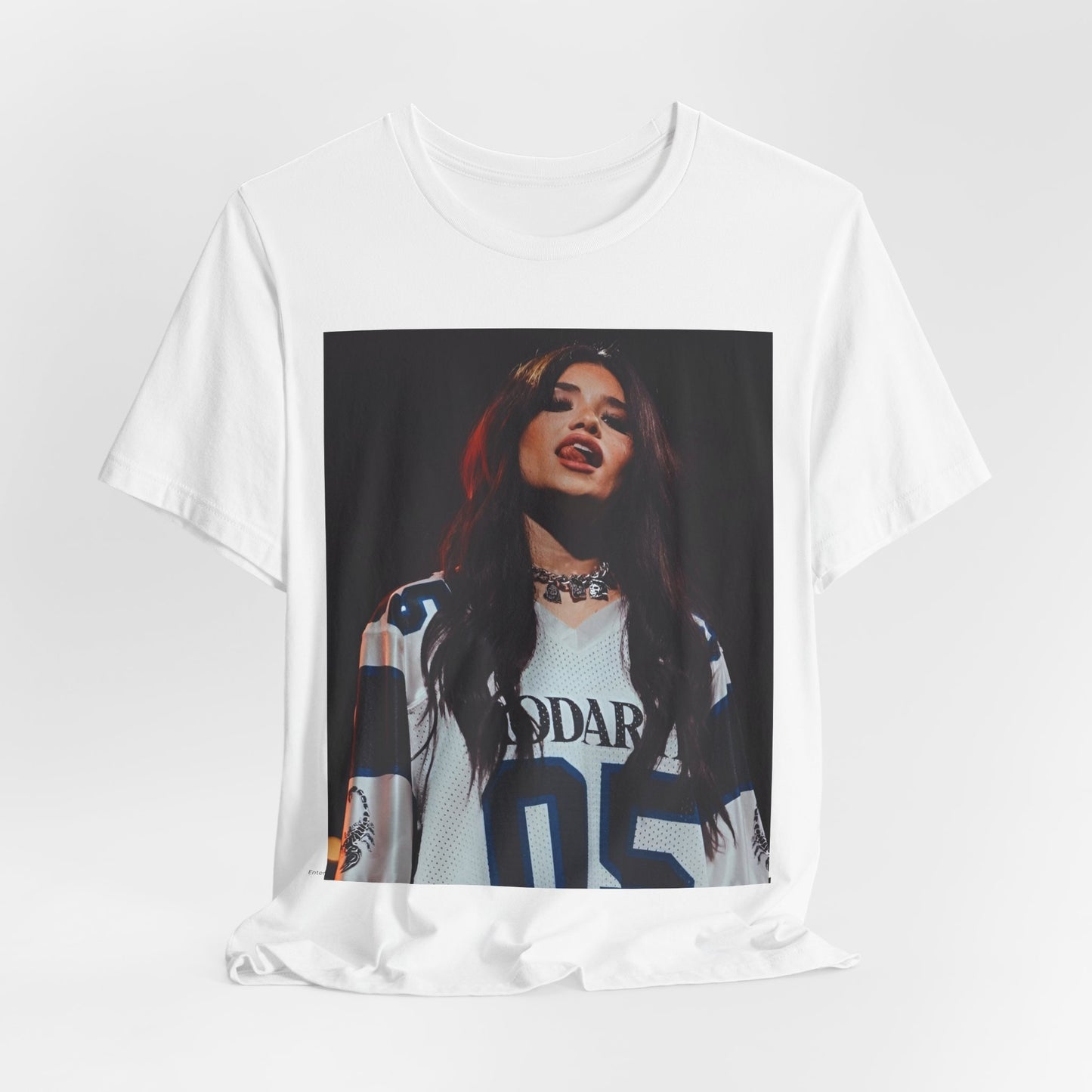 A black graphic t-shirt featuring a graphic or photo of Nessa Barrett performing live.