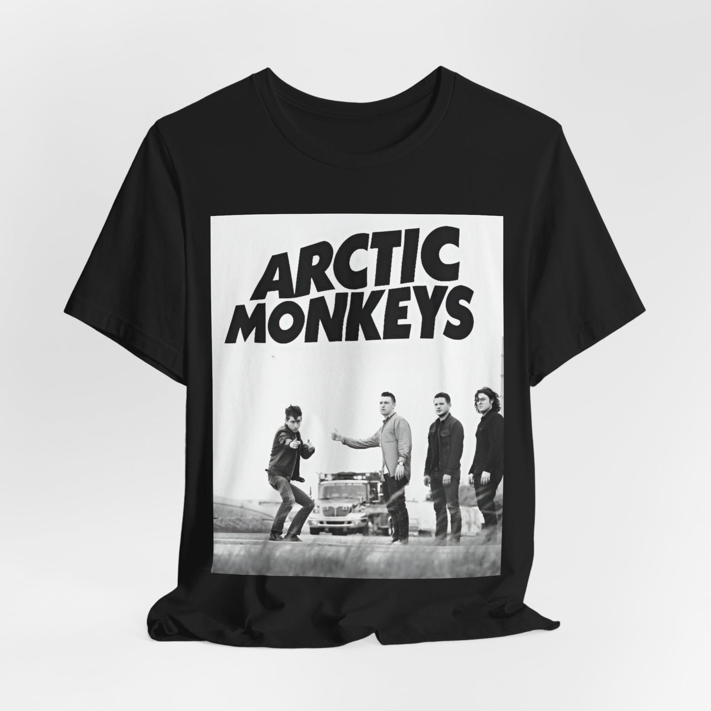 A black graphic t-shirt featuring the Arctic Monkeys logo in black and white.