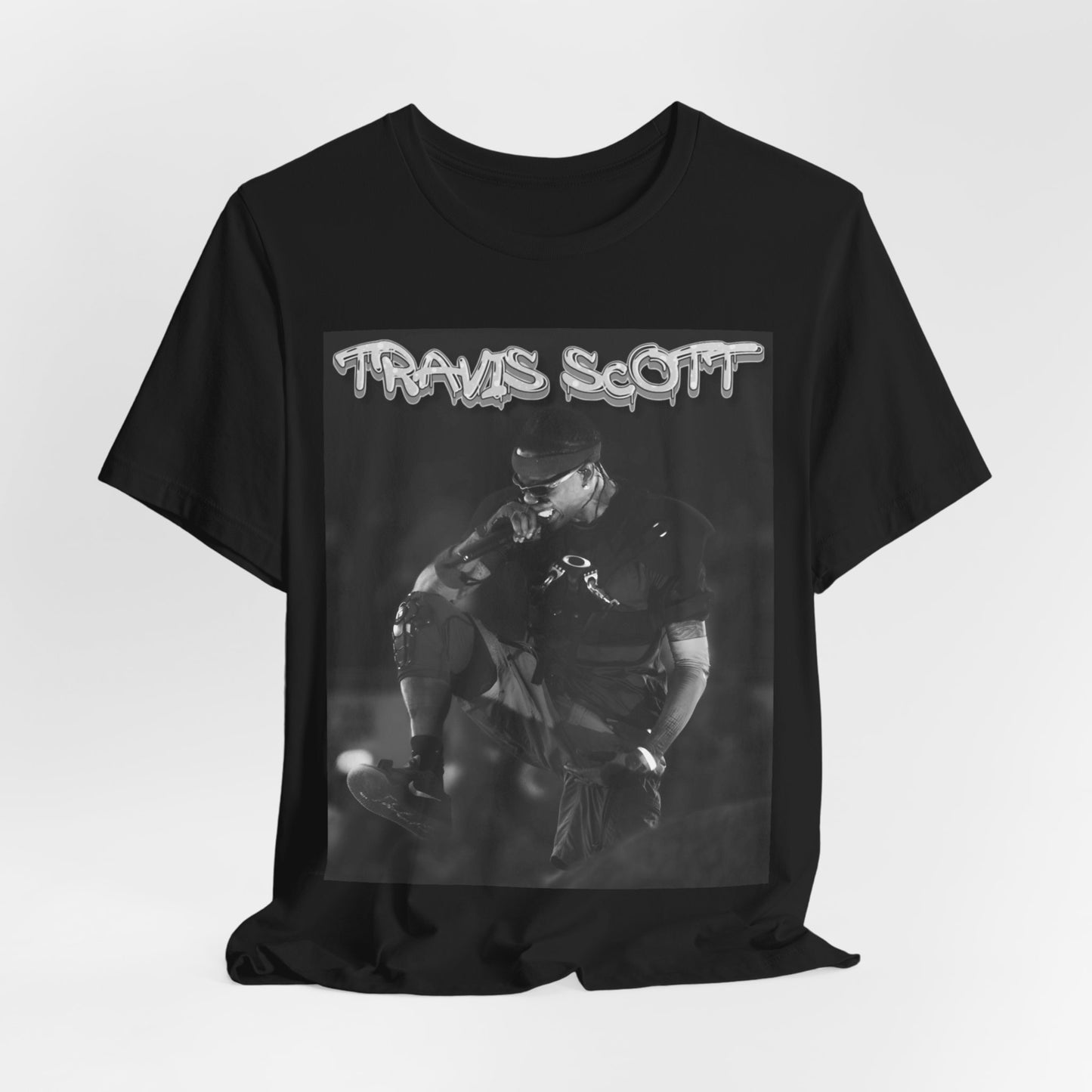 A black graphic t-shirt featuring a casual rap fan graphic of Travis Scott.
