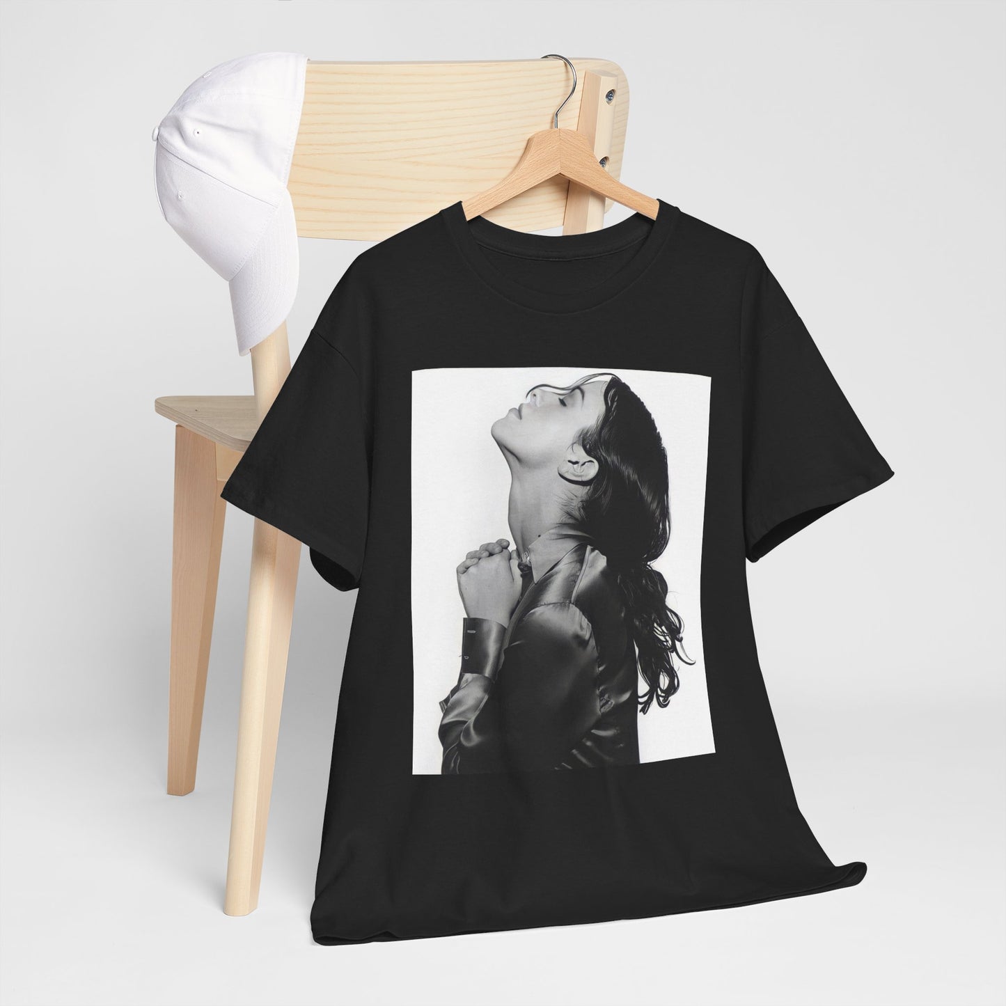 A black graphic t-shirt featuring a vintage black and white portrait of Alanis Morissette, showing her with a poised and thoughtful expression.
