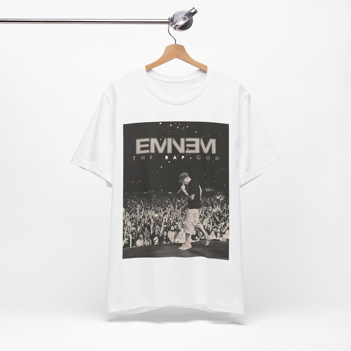 A black graphic t-shirt featuring a graphic or photo of Eminem performing live on tour.