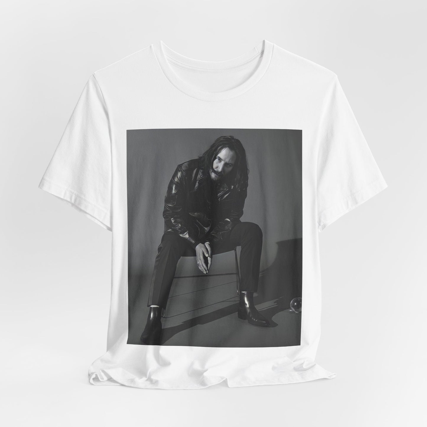 A black graphic t-shirt featuring a graphic of Keanu Reeves as John Wick.