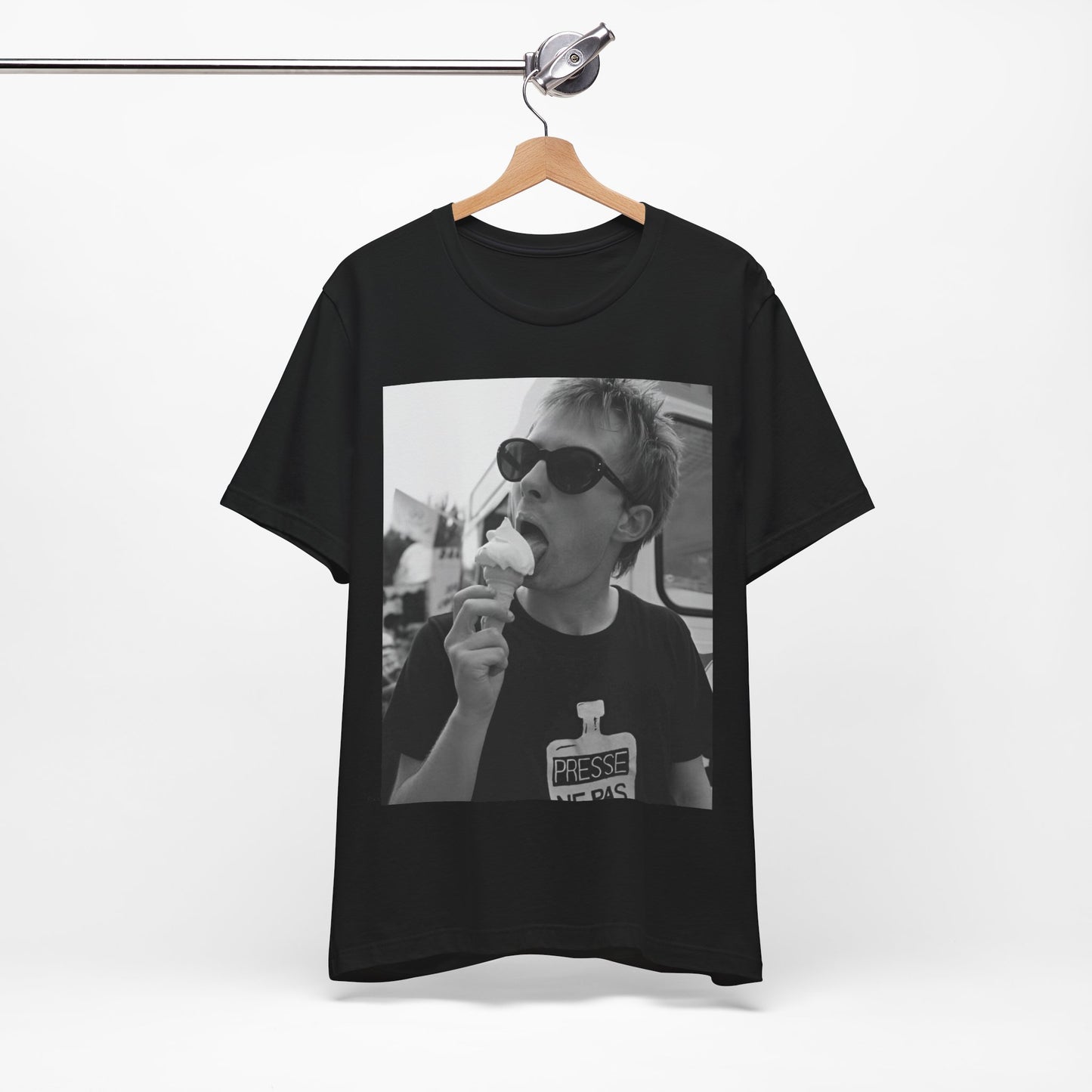 A black graphic t-shirt featuring a graphic of Thom Yorke from Radiohead with an ice cream cone.
