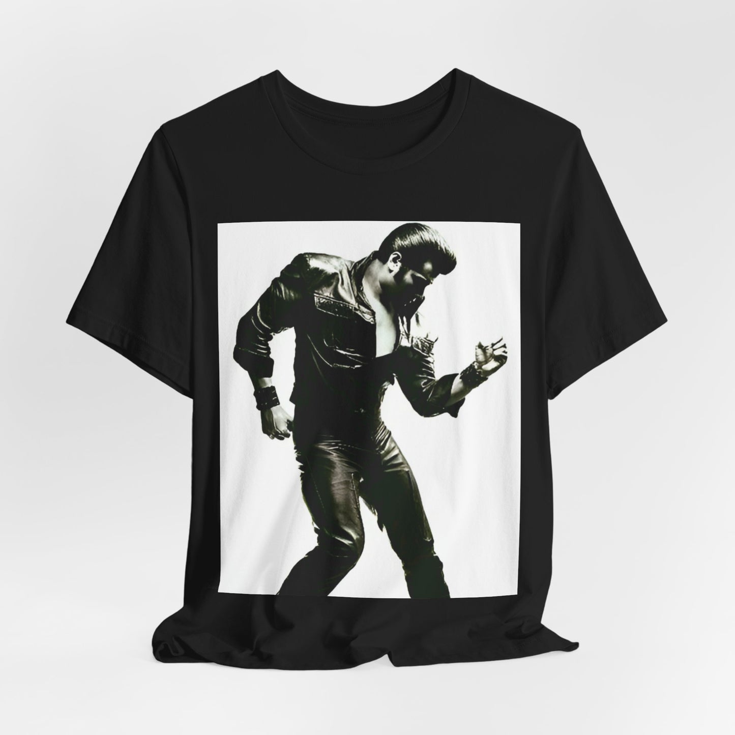 A black graphic t-shirt featuring a retro black and white monochrome photo or graphic of Elvis Presley.
