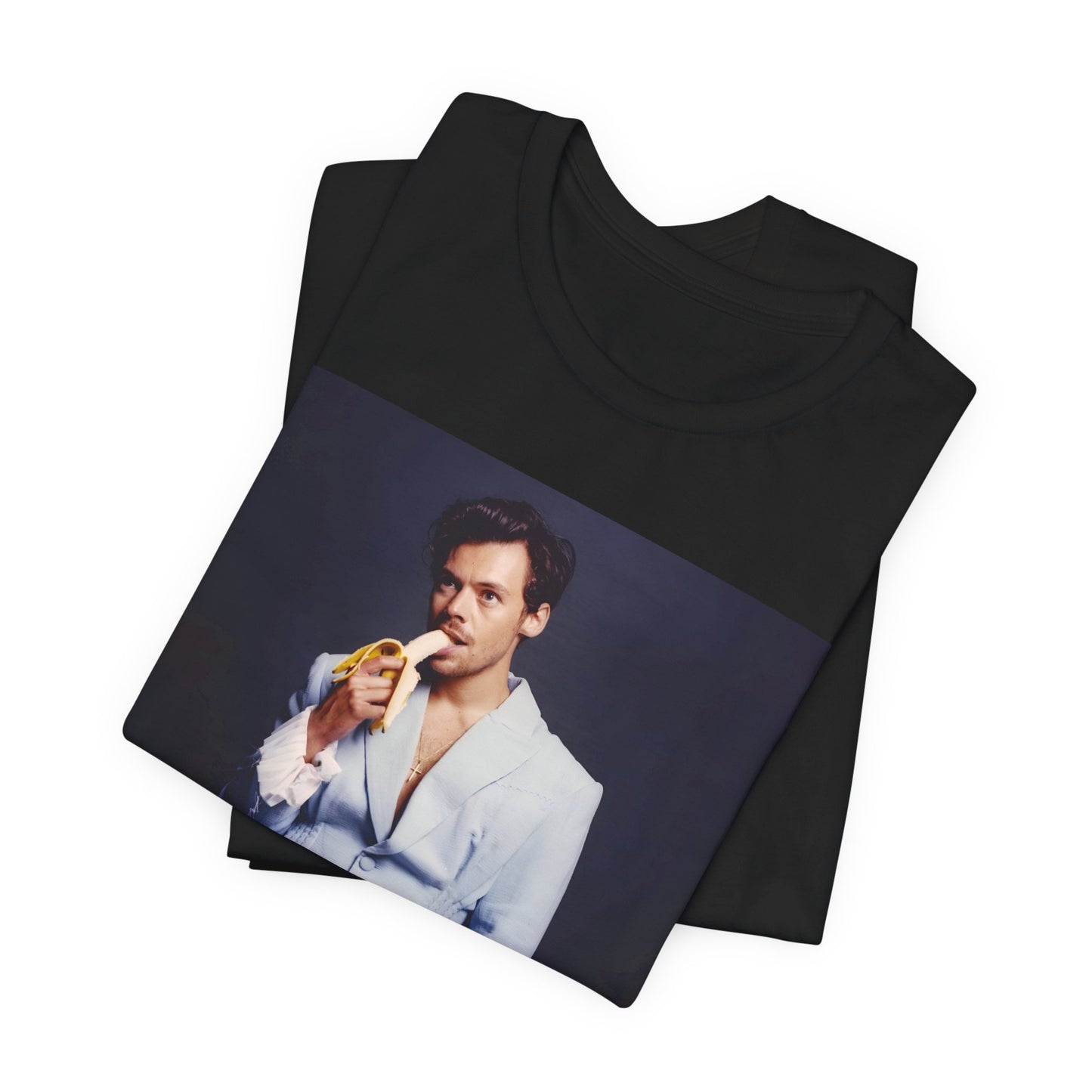 A black graphic t-shirt featuring a graphic related to Harry Styles and his One Direction legacy.