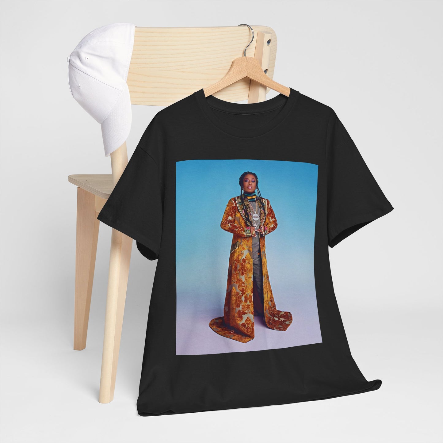 A black graphic t-shirt featuring a graphic of Missy Elliott as an iconic fashion trendsetter.
