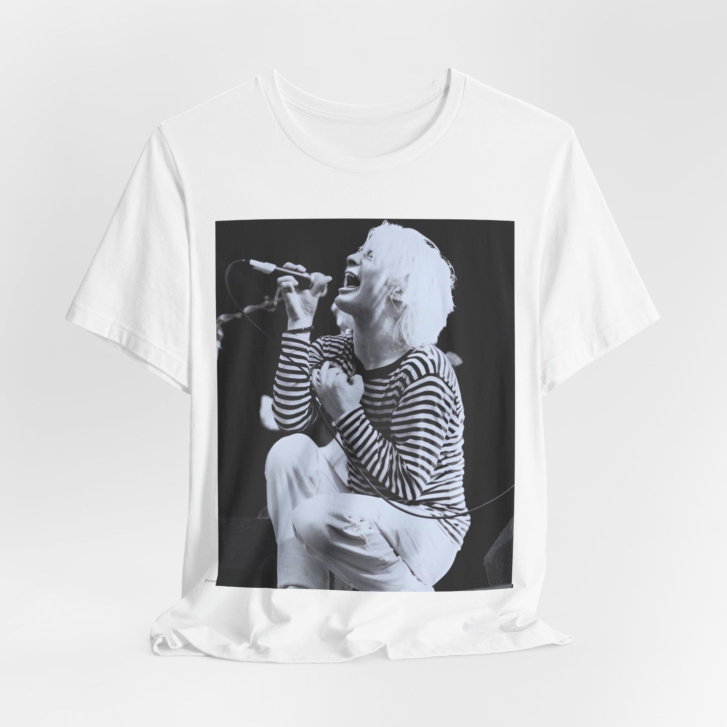 A black graphic t-shirt featuring a black and white graphic or photo of Radiohead performing live.
