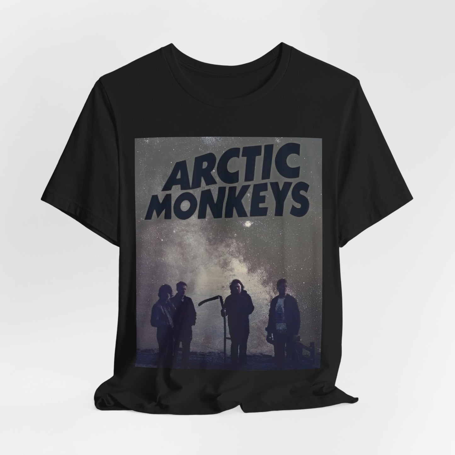 A black graphic t-shirt featuring an artistic or aesthetic graphic of the Arctic Monkeys band.