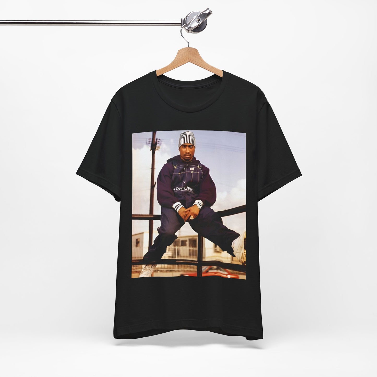 A black graphic t-shirt featuring a timeless rap legend graphic of Tupac.