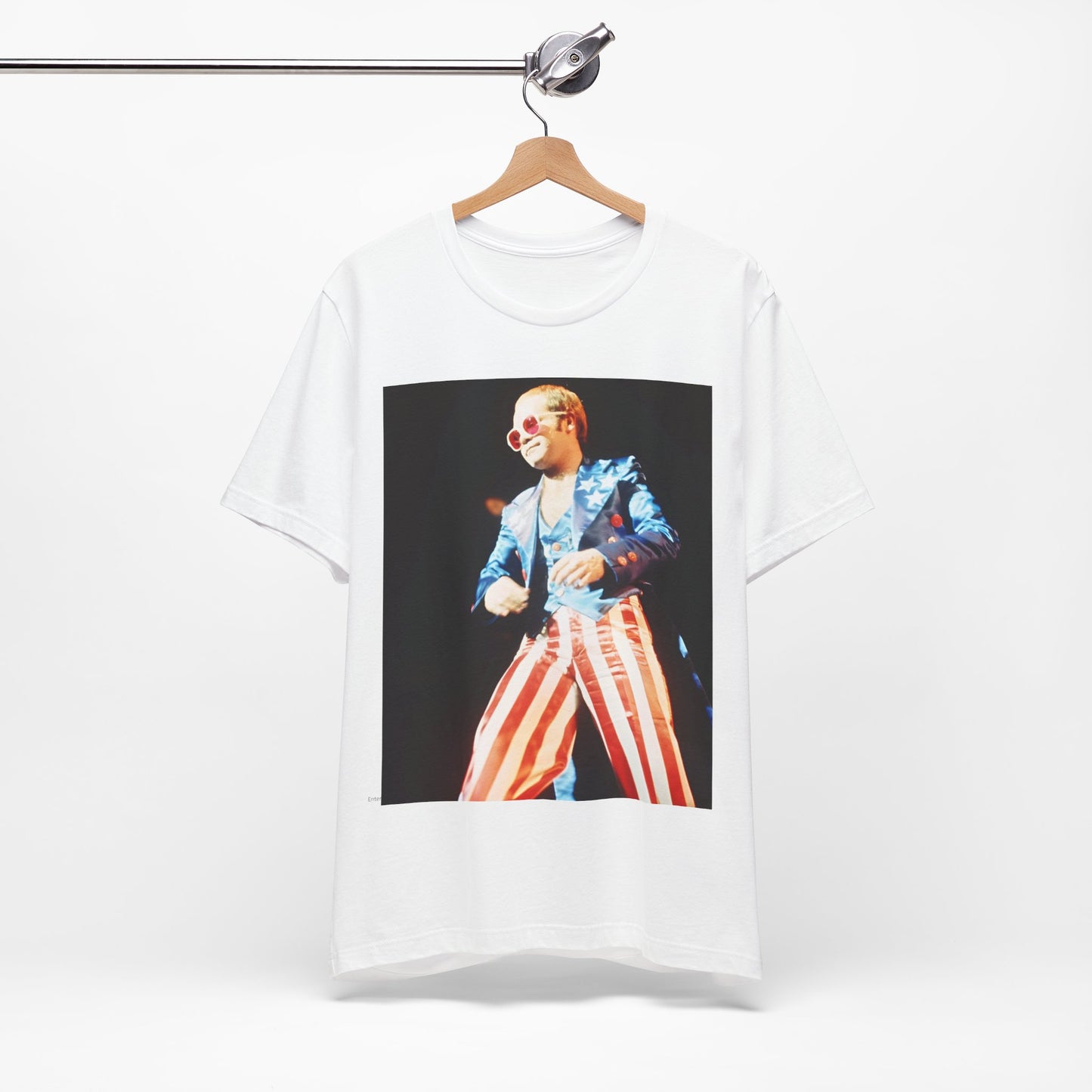A black graphic t-shirt featuring a graphic related to Elton John's 70s America tour.