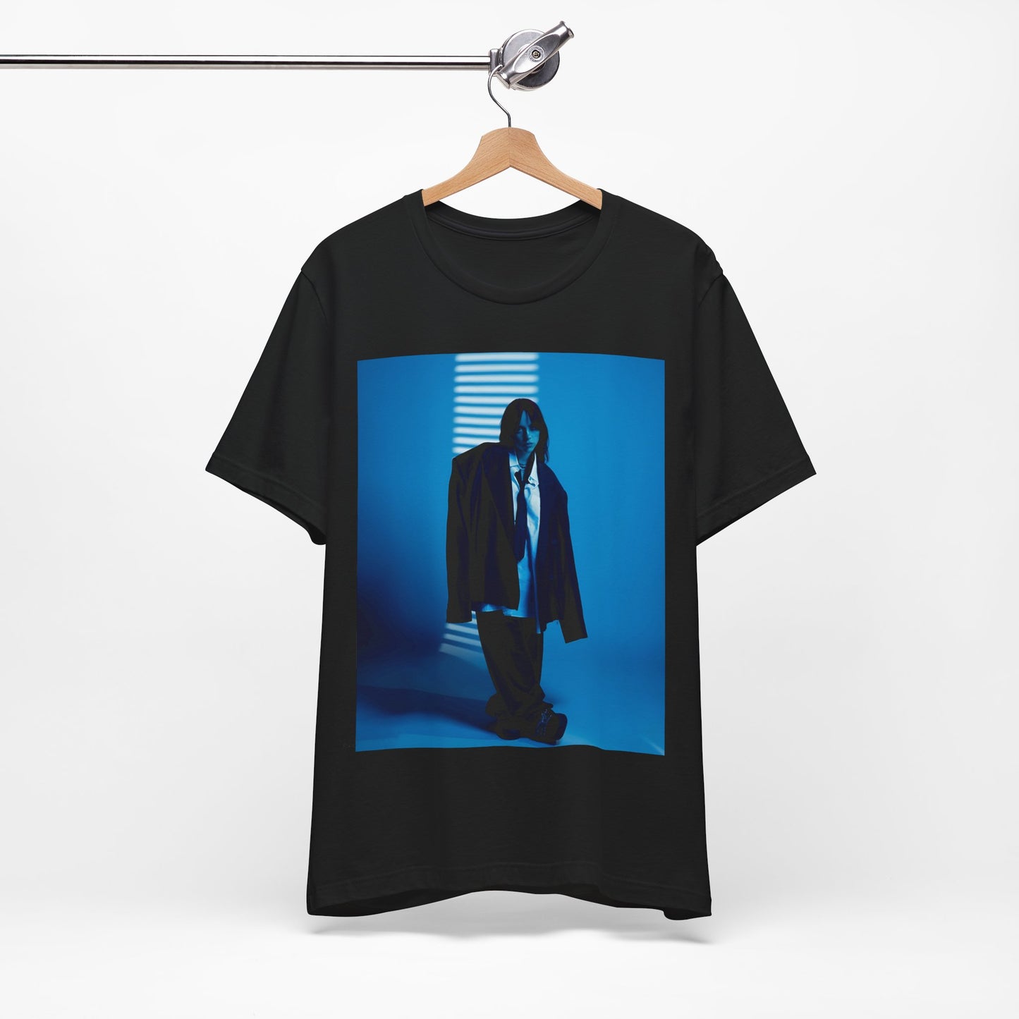 A high-fashion, editorial-style photo of Billie Eilish, embodying a 'breaking the rules' attitude, printed on a graphic t-shirt.