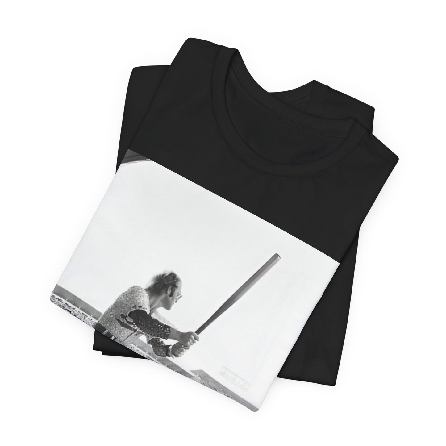 A black graphic t-shirt featuring a black and white graphic or photo related to Elton John's 1975 tour in America.