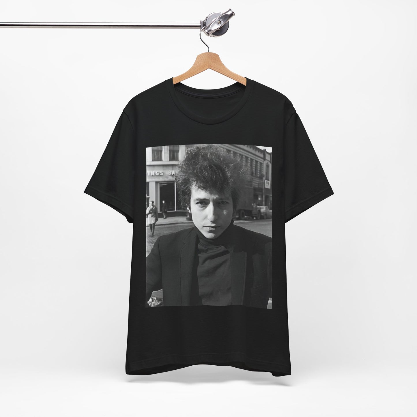 A black graphic t-shirt featuring a 60s black and white photo portrait of Bob Dylan.