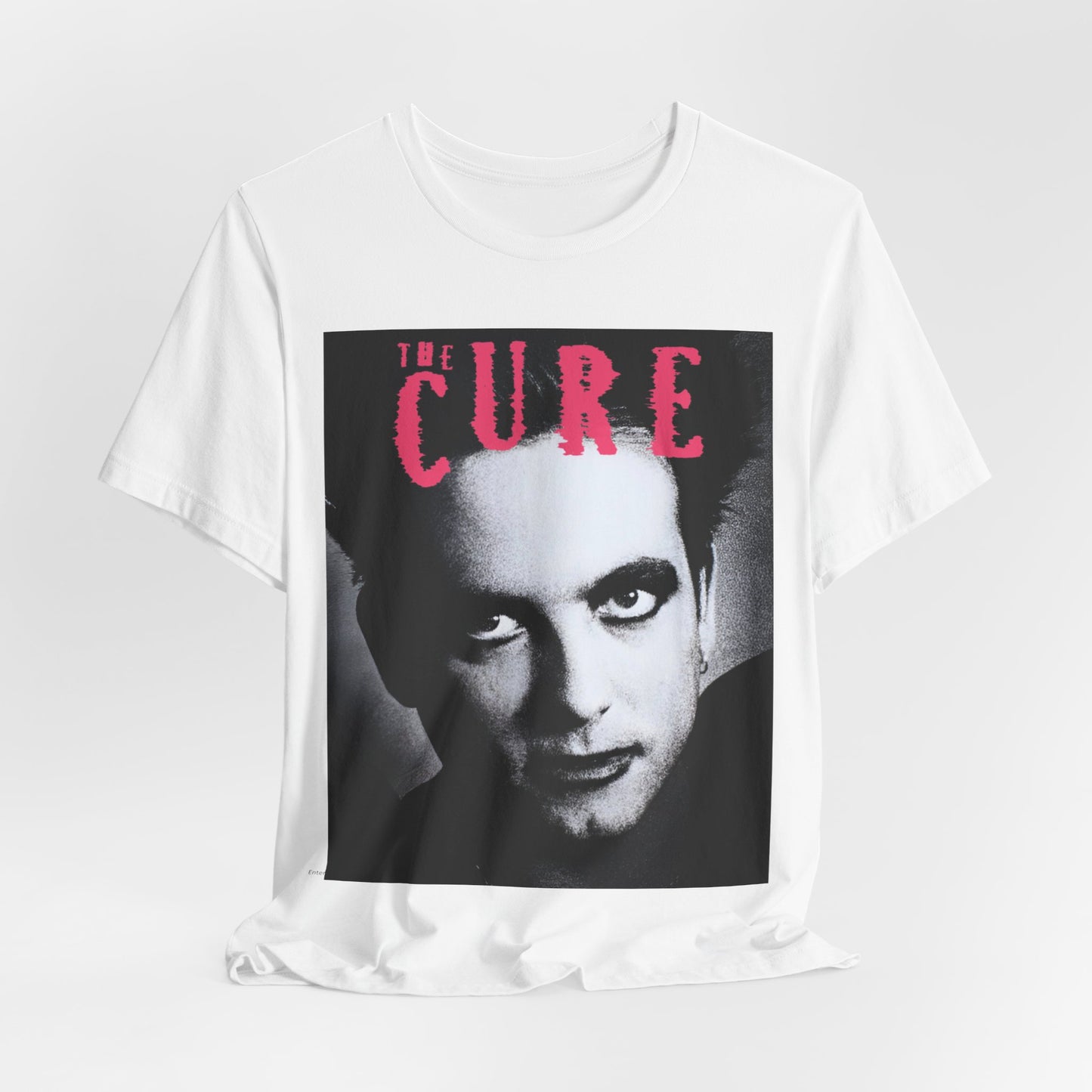 A black graphic t-shirt featuring an 80s post-punk aesthetic graphic of The Cure.