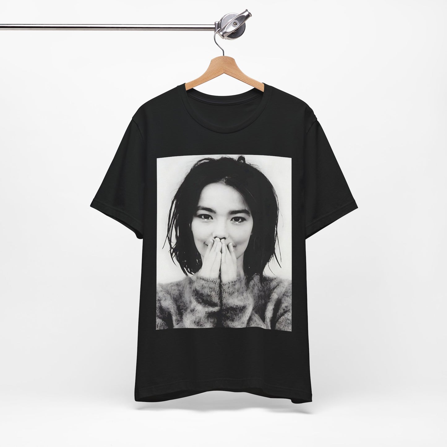 A black graphic t-shirt featuring a 90s black and white photographic portrait of Bjork.