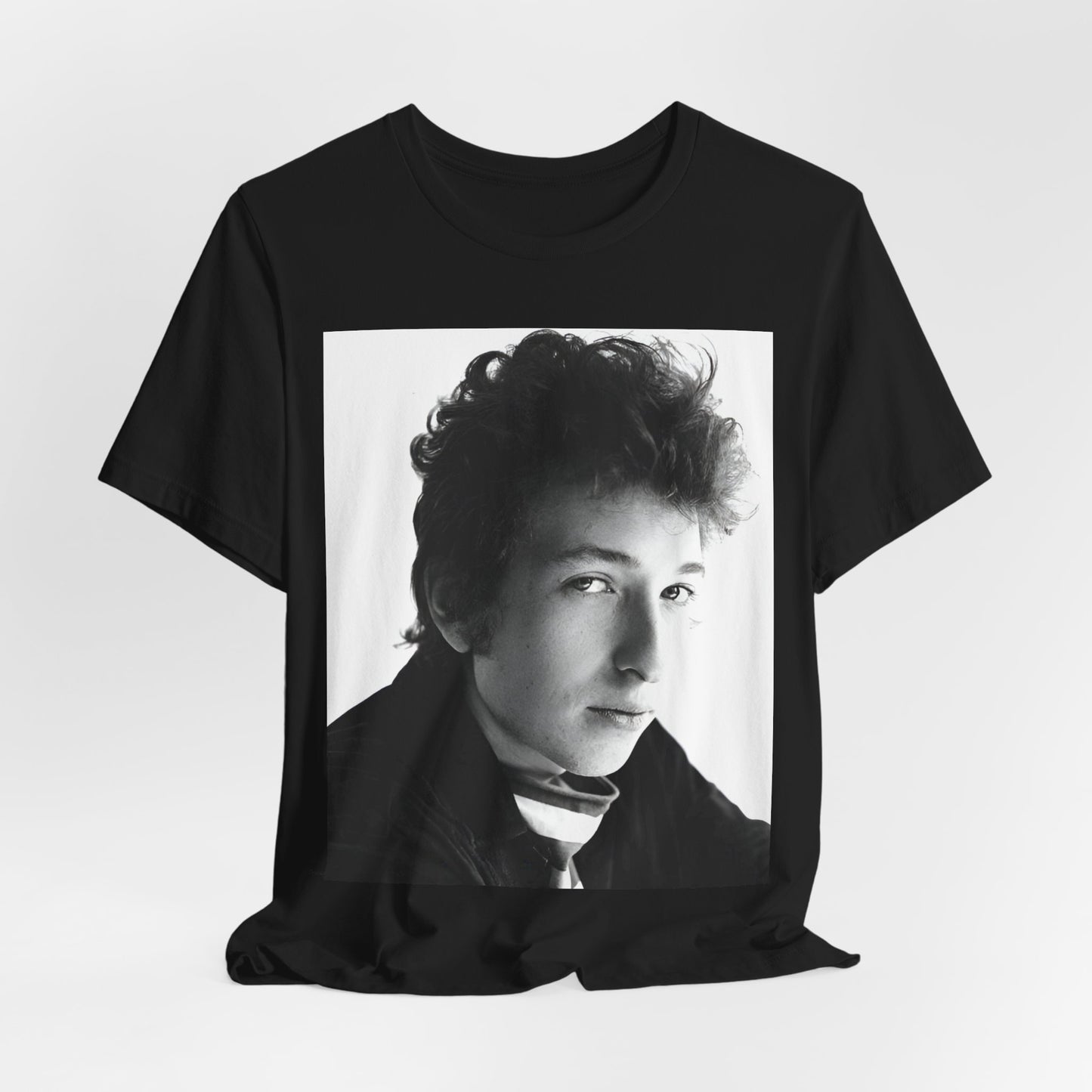 A black graphic t-shirt featuring a graphic related to Bob Dylan's 'Like a Rolling Stone' song or era.
