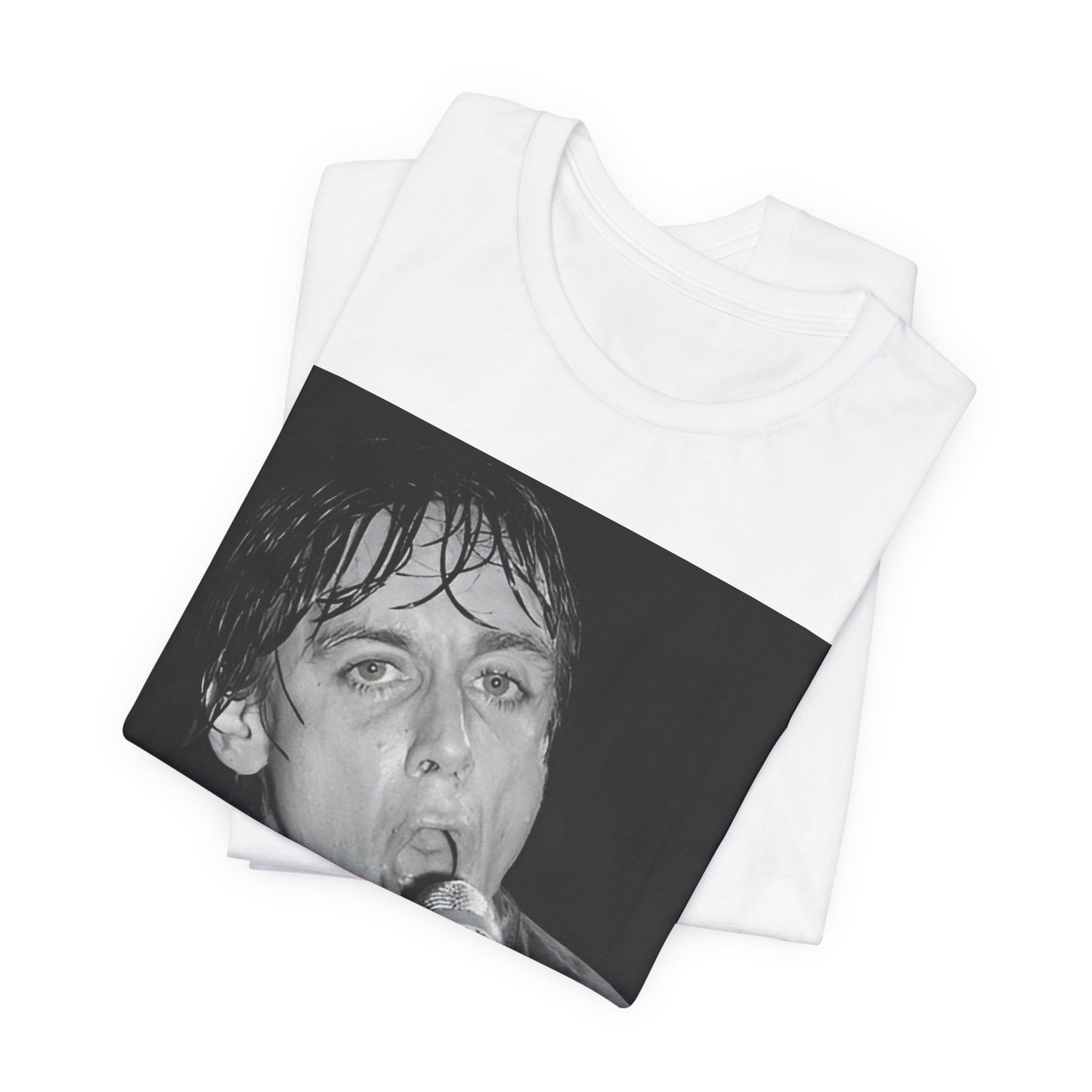 A black graphic t-shirt featuring a 70s graphic or photo of Iggy Pop performing in a wild concert.