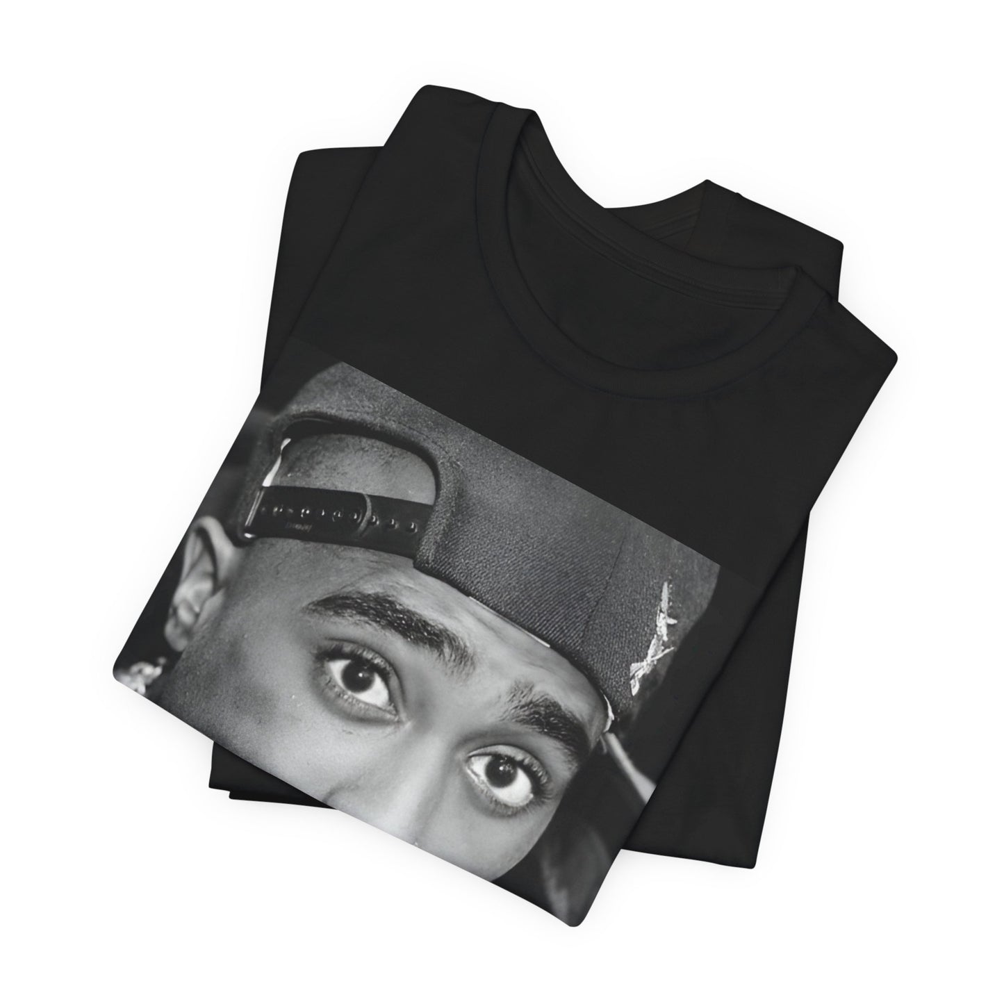 A black graphic t-shirt featuring a bold graphic of Tupac as a rap superstar.