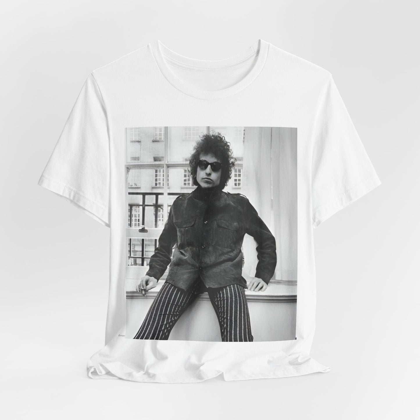A black graphic t-shirt featuring a graphic related to Bob Dylan's 'Highway 61' era, possibly with album art elements or iconic imagery.