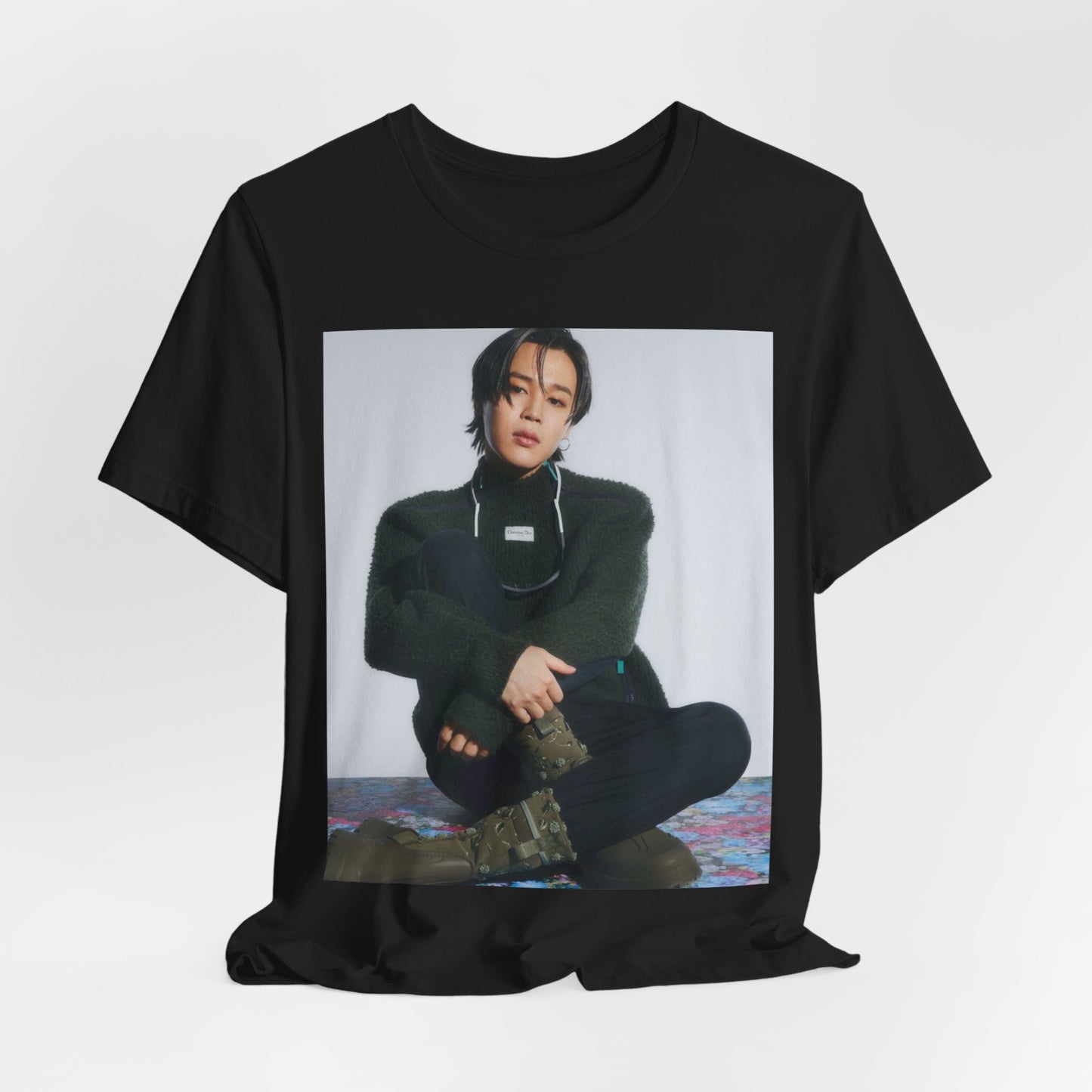 A black graphic t-shirt featuring a modern K-Pop essential graphic of Jimin.