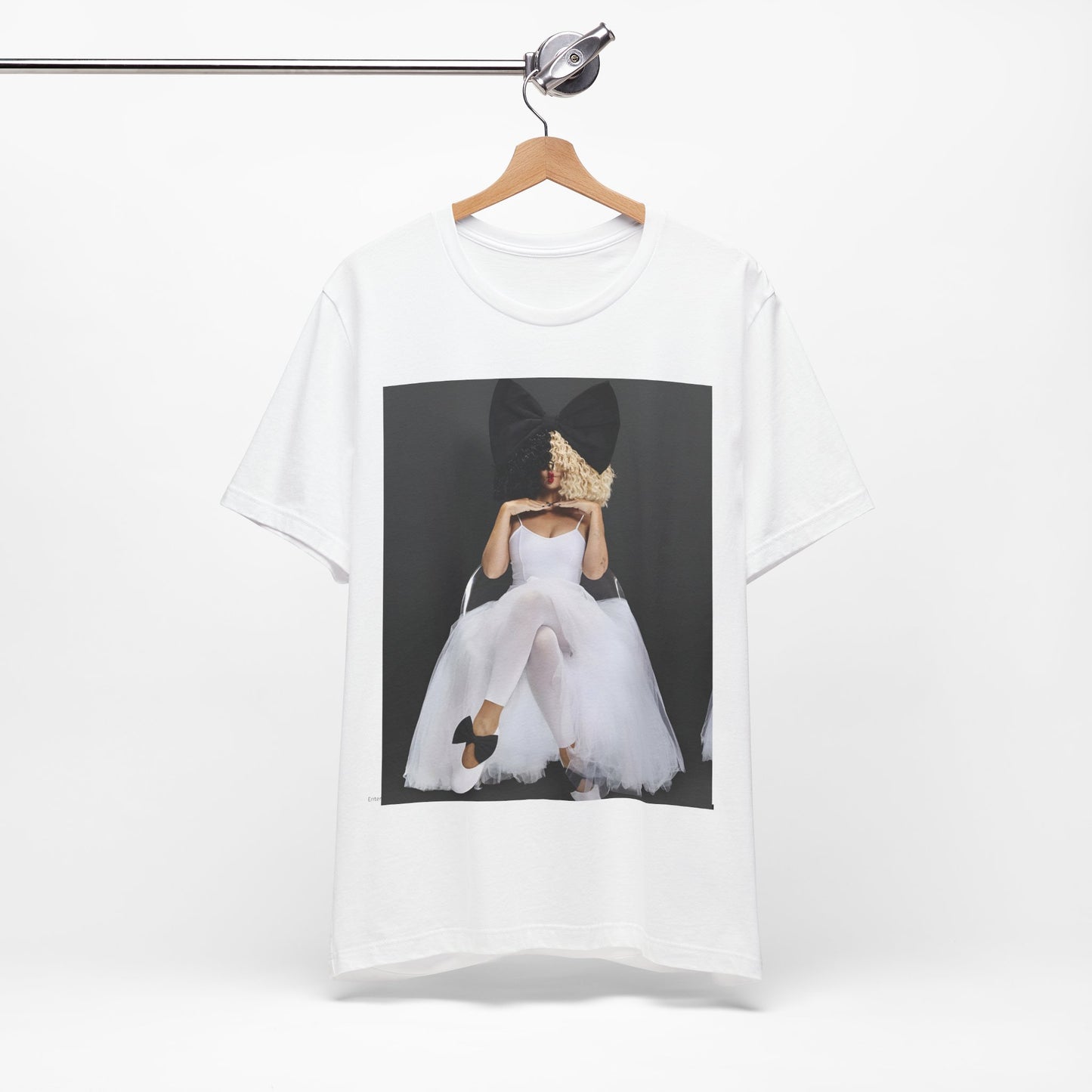 A black graphic t-shirt featuring a graphic of Sia's iconic wig style.