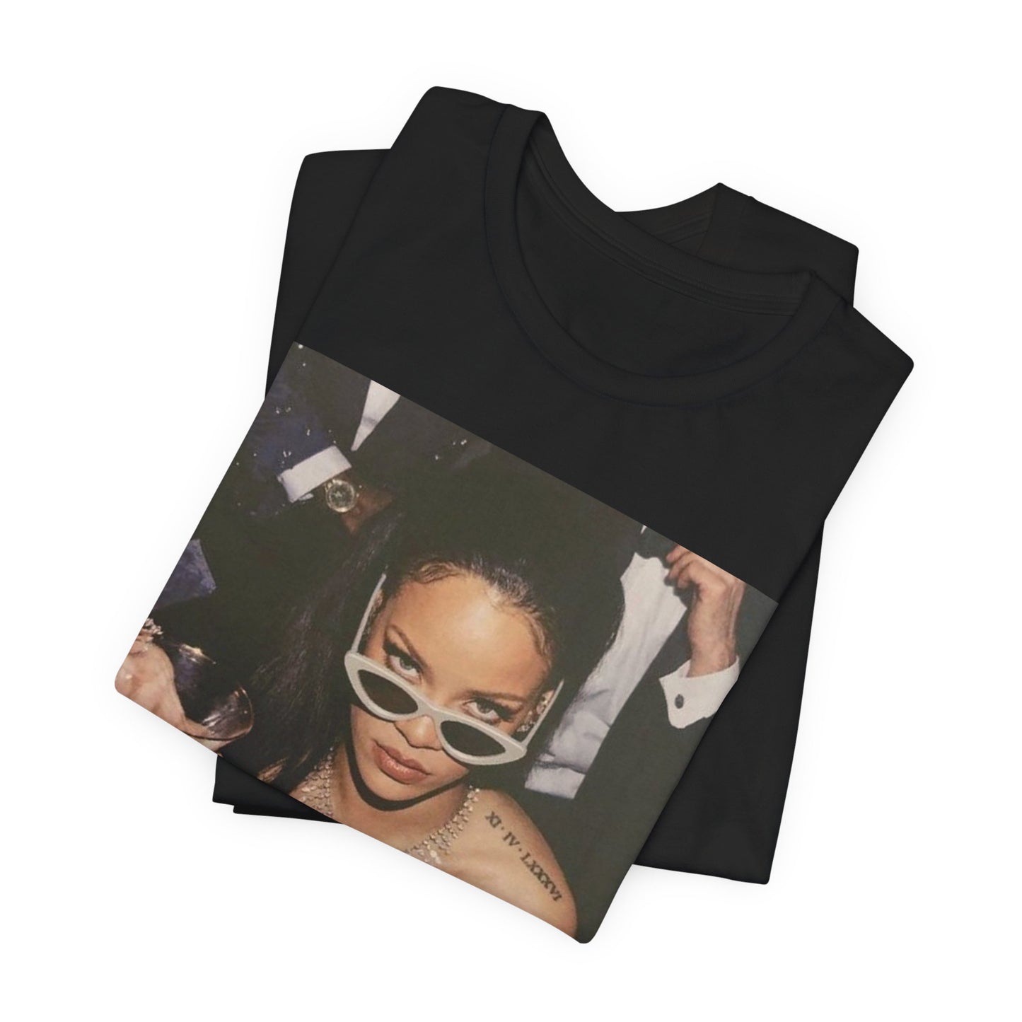 A black graphic t-shirt featuring a graphic of Rihanna as a 'Bad Gal Riri' fashion icon.
