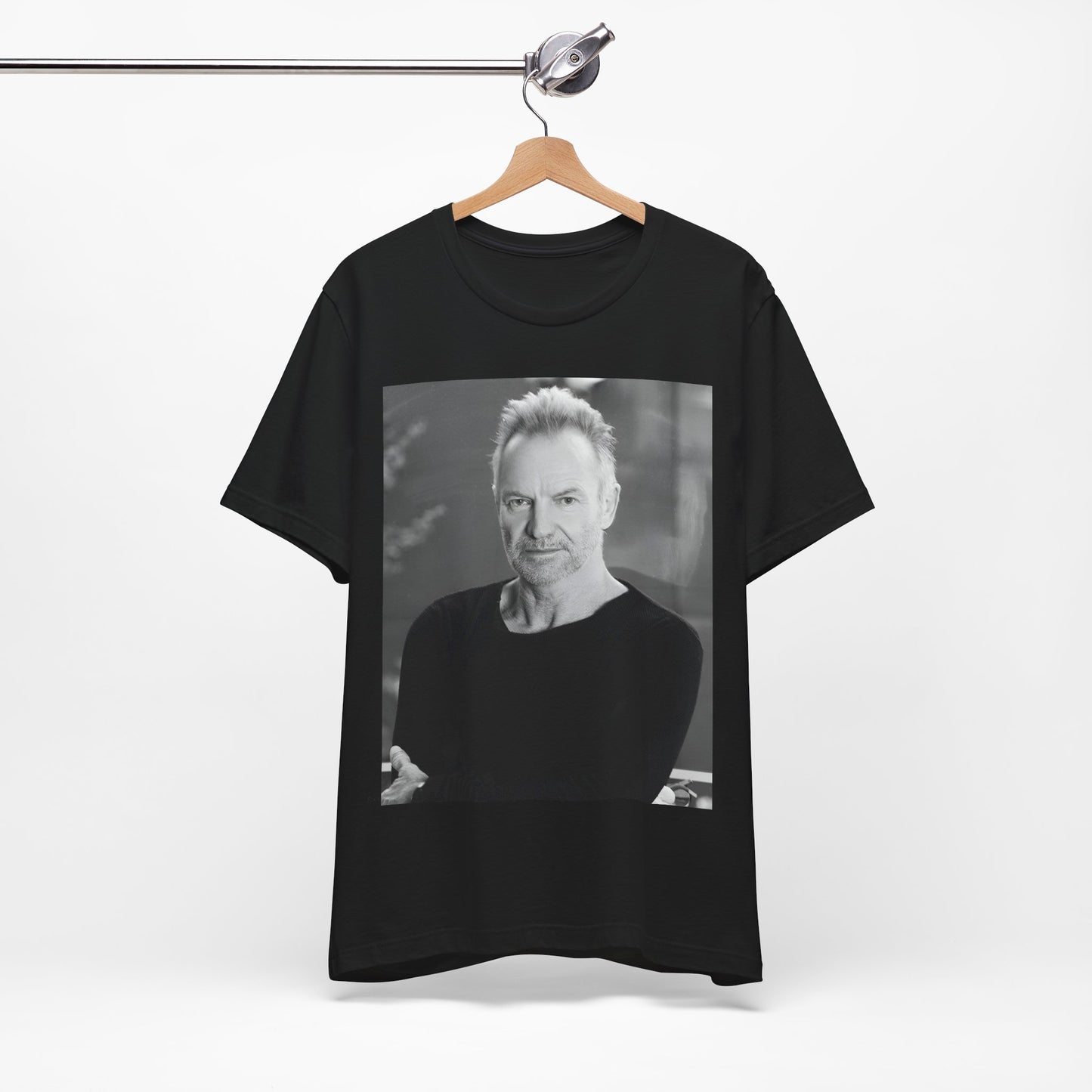 A black graphic t-shirt featuring a vintage graphic related to Sting's 'Desert Rose' song or era.