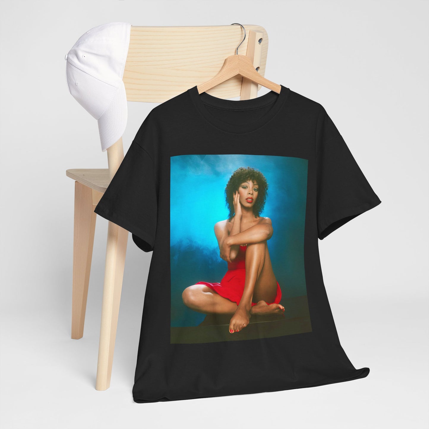 A black graphic t-shirt featuring a vintage 70s graphic of Donna Summer as a disco queen.