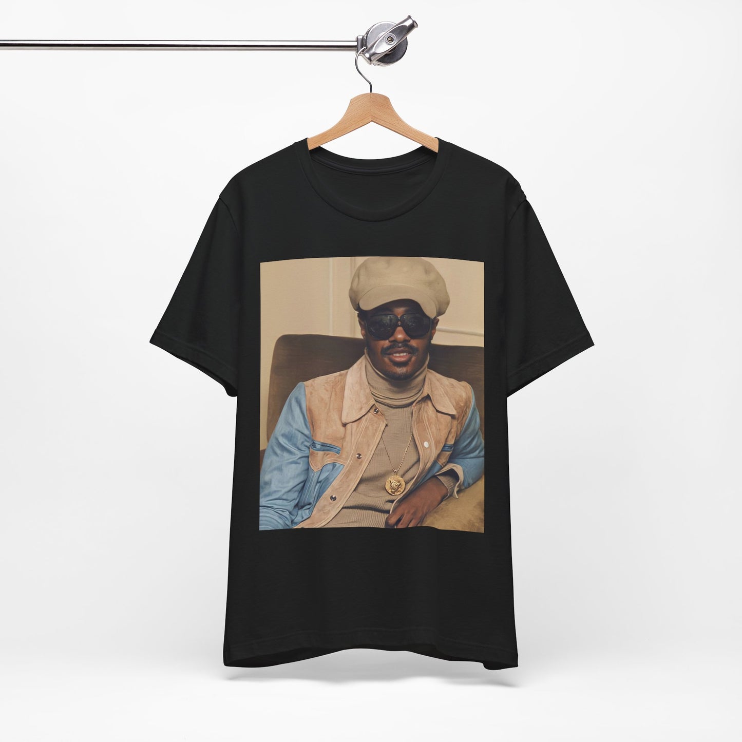 A black graphic t-shirt featuring a retro graphic related to Stevie Wonder's 'Songs in the Key of Life' album era.