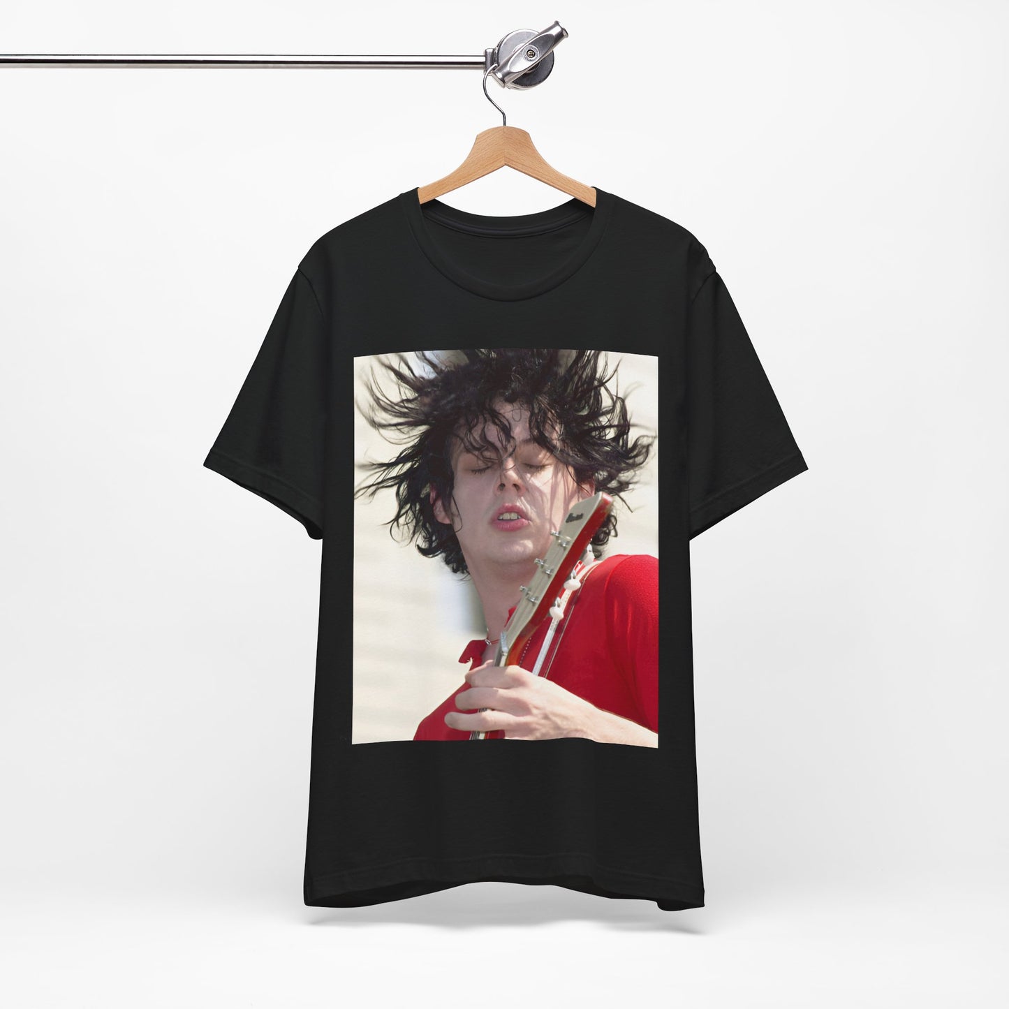 A black graphic t-shirt featuring a retro graphic of Jack White from The White Stripes playing guitar.