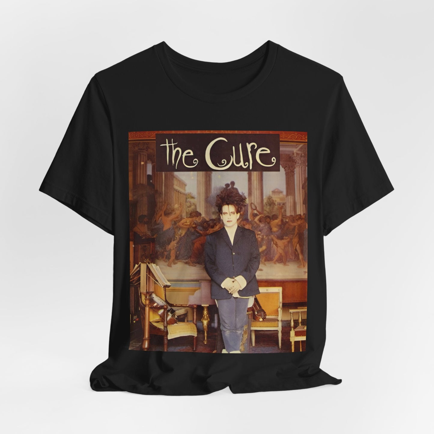 A black graphic t-shirt featuring a graphic of Robert Smith from The Cure as a goth icon.