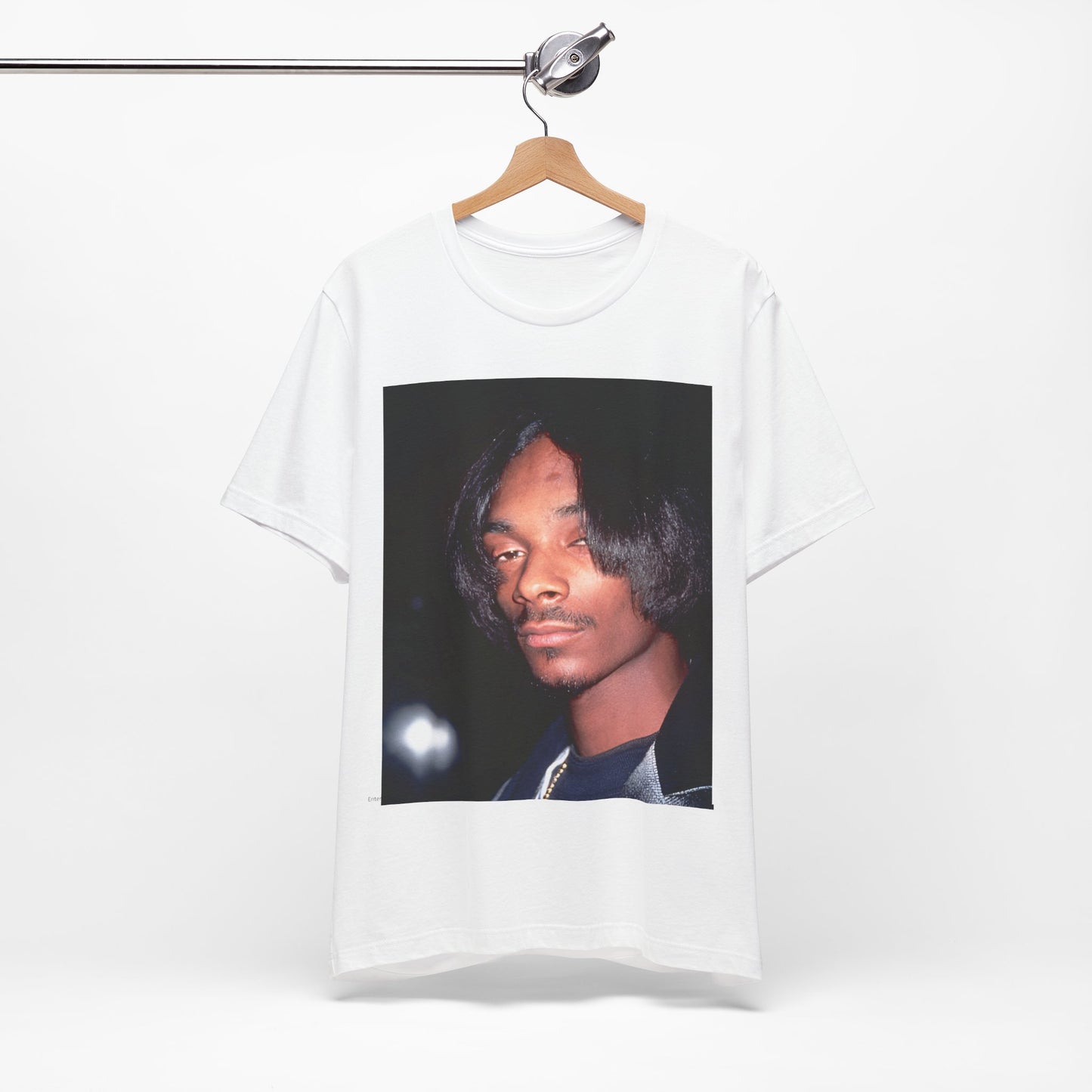 A black graphic t-shirt featuring a 90s black and white graphic of Snoop Dogg as a global icon in rap.