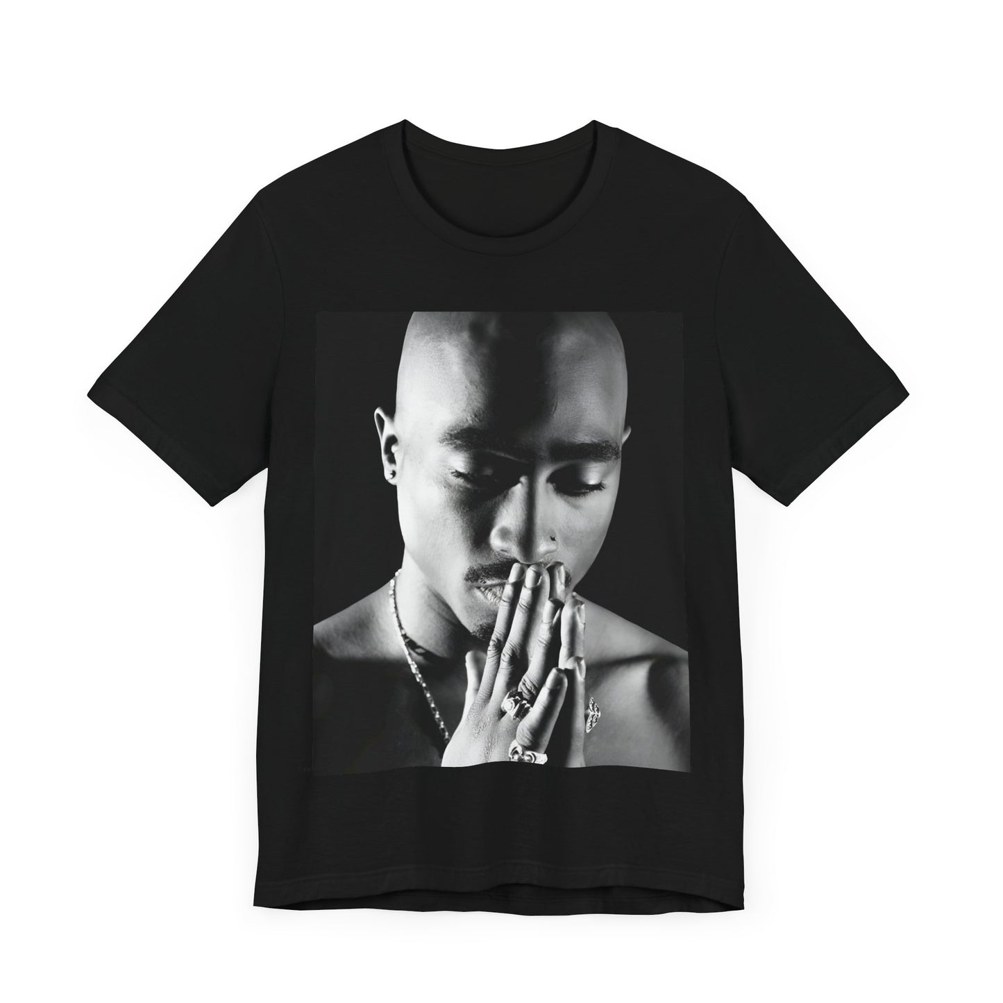 A black graphic t-shirt featuring a black and white streetwear rebel graphic of Tupac.