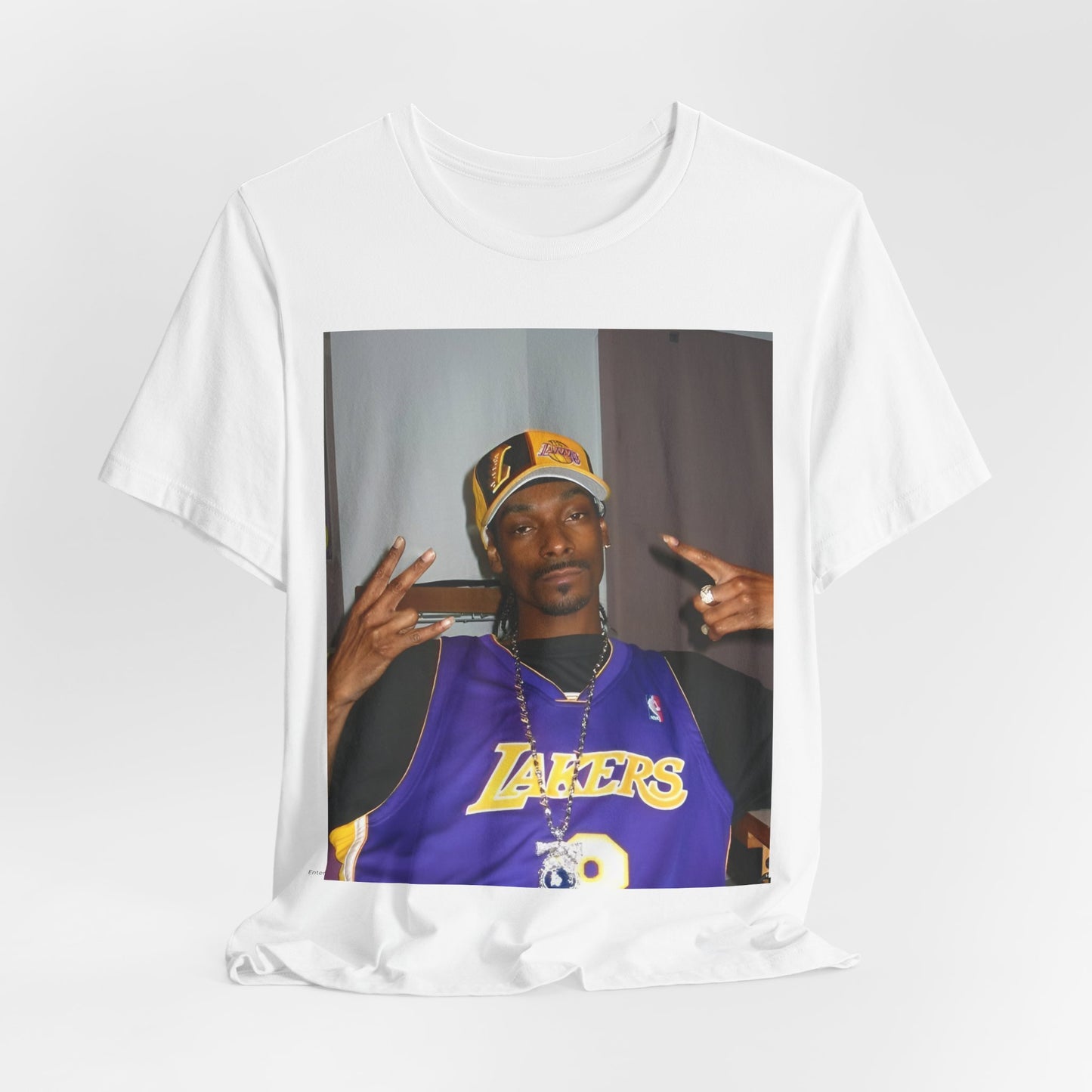 A black graphic t-shirt featuring a graphic of Snoop Dogg with Lakers branding or colors.