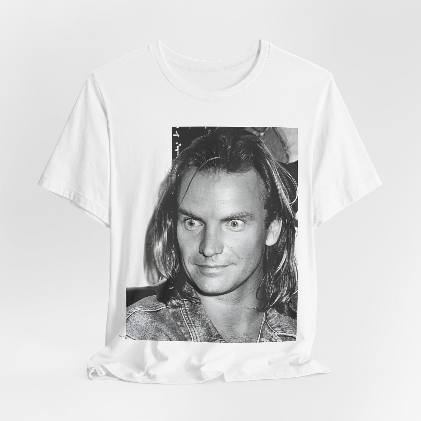 A black graphic t-shirt featuring a retro graphic related to Sting's 'Synchronicity' album era.