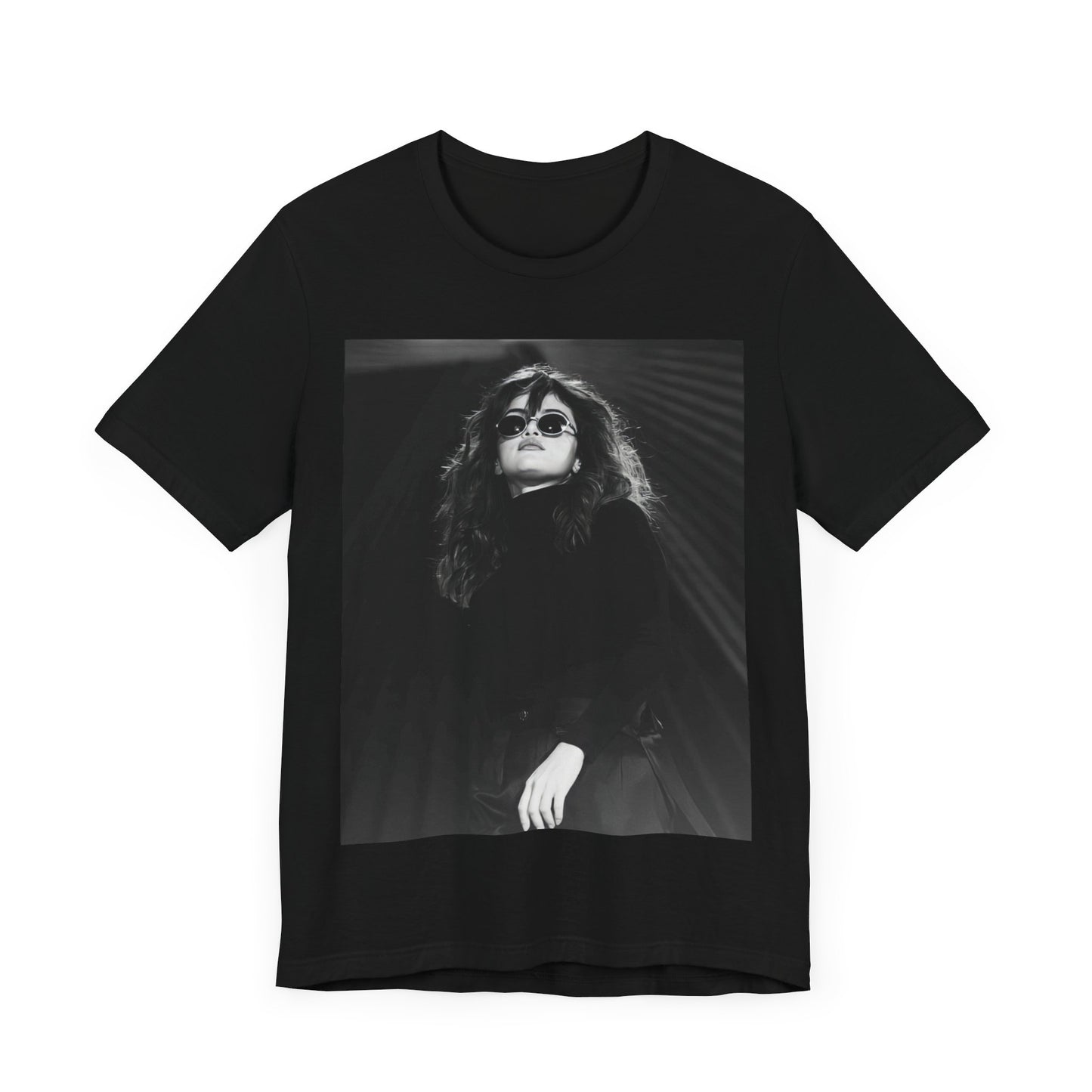 A black graphic t-shirt featuring a black and white, monochrome graphic or photo of Selena Gomez.