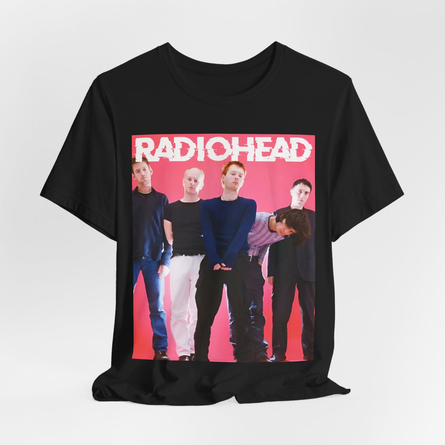 A black graphic t-shirt featuring a 90s alternative aesthetic graphic of Radiohead.