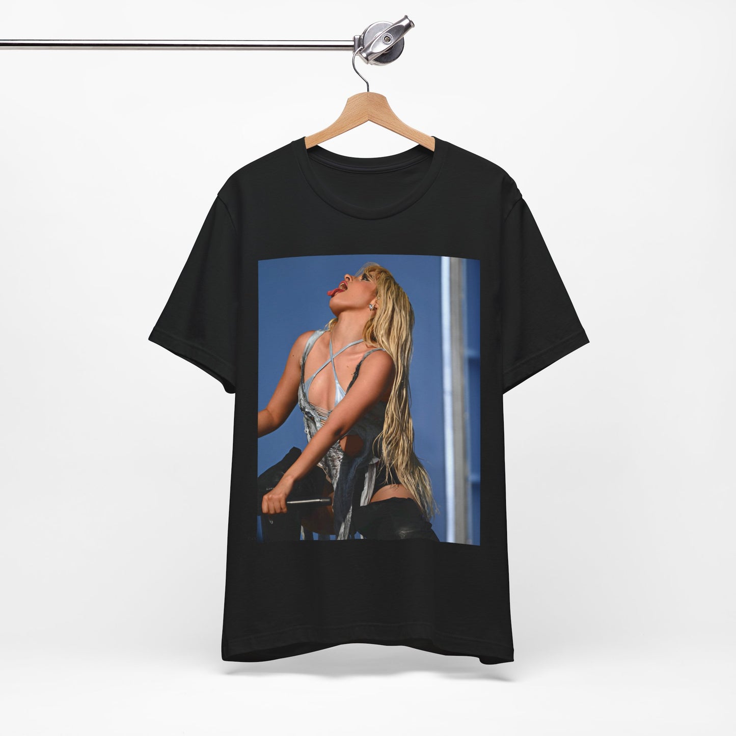 A black graphic t-shirt featuring a dynamic graphic or photo of Camila Cabello performing live on stage.