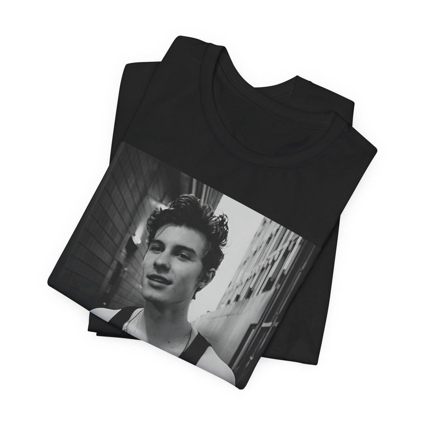 A black graphic t-shirt featuring a vintage black and white portrait graphic or photo of Shawn Mendes.