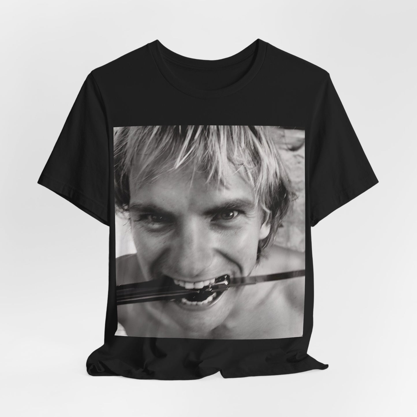 A black graphic t-shirt featuring a wild photo graphic of Sting.