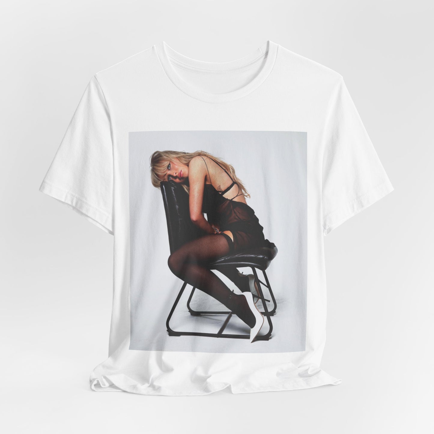 A black graphic t-shirt featuring a playful pop art style graphic of Sabrina Carpenter.